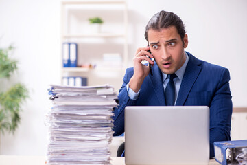 Sticker - Young male employee unhappy with excessive work