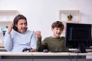 Wall Mural - Father and son playing computer games