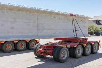 Canvas Print - Special transport with a beam. Specific platform for transporting beams or other elements of large dimensions and weights.