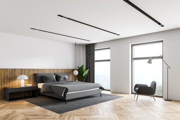 White master bedroom corner with armchair