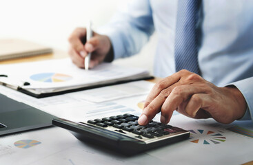 Fototapete - businessman working with using calculator in office. finance and accounting concept