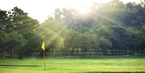 Wall Mural - Beautiful golf course at the sunset, sunrise time.