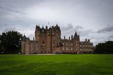 Glamis Castle In The Scottish Countryside On A Cloudy Day, Scotland, United Kingdom