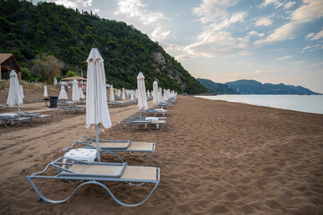 lounge chairs on the beach, Corfu, Greece