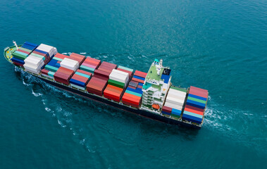 Aerial view of a business container cargo ship in import export business commercial trade logistic which a containers in a harbor of the sea