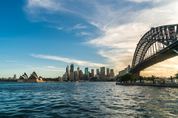 Fototapete - Sydney harbor bridge with Sydney CBD downtown skyline at sunset, Sydney, New South Wales, Australia