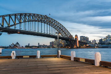 Fototapete - Colorful Sydney downtown skyline with harbor bridge at night in Sydney, New South Wales, Australia