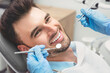 © Proxima Studio - Man having teeth examined at dentists