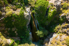 Aerial View Of A Narrow Waterfall In A Steep, Rocky Gorge (Richtis Gorge, Crete, Greece)