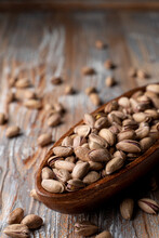 Sunflower Seeds In A Wooden Bowl On A Light Rustic Wooden Table, Close Up, Selective Focus, Catalogue Photo