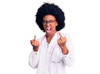 Young african american woman wearing doctor coat and stethoscope showing middle finger doing fuck you bad expression, provocation and rude attitude. screaming excited