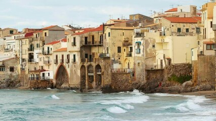 Wall Mural - Historic buildings in Cefalu Old town at sunset