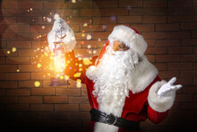 African-American Santa Claus With Lantern On Dark Brick Background