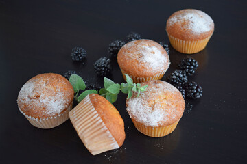 Wall Mural - Muffins - delicious pastries. Delicious dessert on the table - homemade muffins. Portioned cupcakes. 