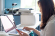 © themorningglory - Successful happy girl manager in her own office working with laptop