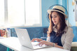 © themorningglory - Successful happy girl manager in her own office working with laptop