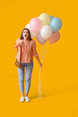 Sticker - Surprised young woman with balloons on color background