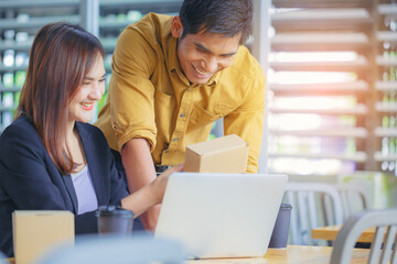 friendly asian colleagues having conversation in office, packaging design creative designer workers 