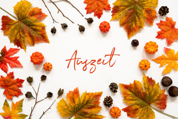Wall Mural - beautiful calligraphy of german text auszeit means downtime. frame of bright colorful autumn leaf de