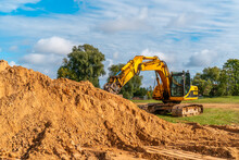 Heavy Yellow Excavator During Earthmoving Works