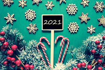 Wall Mural - Black Sign With English Text 2021. Christmas Decoration, Like Fir Tree Branch, Candy Sticks, Snowflakes And Stars And Lights. Retro Look