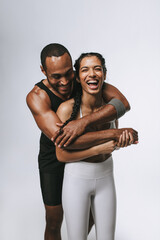 Wall Mural - Portrait of fit couple having fun at workout