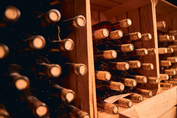 Bottles of wine stored in wooden racks