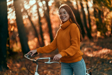 Wall Mural - Woman in park in autumn