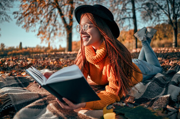 Wall Mural - Woman in park in autumn