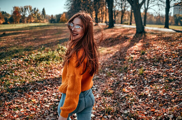 Wall Mural - Woman in park in autumn