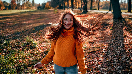 Wall Mural - Woman in park in autumn