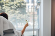 © Viacheslav Yakobchuk - Female with a glass of beverage undergoing a medical procedure