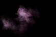 © sergio34 - Purple powder explosion on black background. Colored powder cloud. Colorful dust explode. Paint Holi.