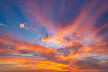 Wall Mural - dramatic orange sky with clouds, sunset background