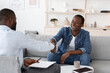 © Prostock-studio - Gratittude For Work. Black Man Handshaking With Psychologist After Therapy Session Meeting