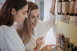 © zinkevych - Two pretty women discussing beauty products in salon