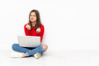 © luismolinero - Tenaager girl working with pc isolated on white background frustrated by a bad situation