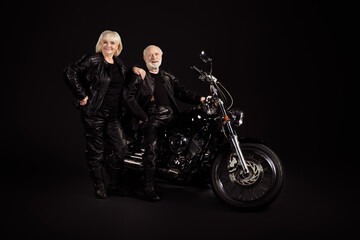 Poster - Portrait of his he her she nice attractive trendy fashionable cool cheerful cheery grey-haired couple chopper travelers enjoying way road voyage trip tour isolated over black color background