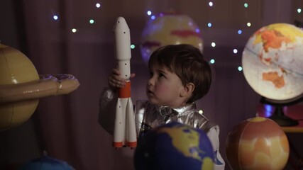 Wall Mural - Space Travel Spaceship. Creative Little Kid Boy Astronaut Launching Rocket From Spaceport Through Planets. Child Dreamer Playing Toy Space Rocket Flying Among Planets. Spaceman Fantasy Flying on Space