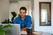 © mavoimages - Young man working from home using a laptop