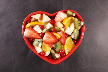 Wall Mural - heart shape bowl with fresh fruits