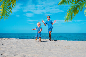 Wall Mural - cute boy and girl dance at beach, kids enjoy vacation at sea