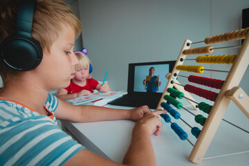 kids having online math lesson at home, distant learning