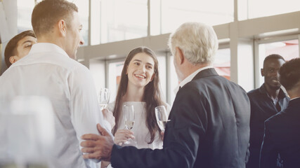 Multi-ethnic people Or businessman Party talk at company event. Celebrate a success workplace. Meeting happy between colleagues. End of quarantine and return to work Business