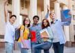 © Prostock-studio - Happy First-Year Students Posing Standing Outside, Excited About Entering University