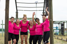 Portrait Of Group Of Woman Cheering Together At Boot Camp