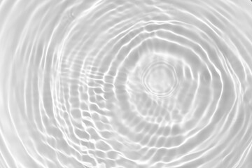 blurred desaturated transparent clear calm water surface texture with splashes and bubbles. trendy a