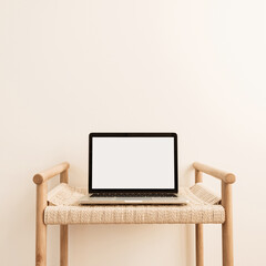 Wall Mural - Laptop with blank screen on wicker bench against white wall. Minimal work / business / interior design template with mockup copy space