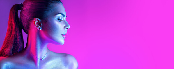 Wall Mural - Colorful portrait of a beautiful young woman over purple background. High Fashion model girl in colorful bright neon lights posing in studio, night club. Portrait of beautiful girl in UV. Art design