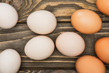 Sticker - top view of fresh chicken eggs on wooden surface